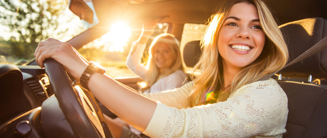 Young woman behind the wheel of a car